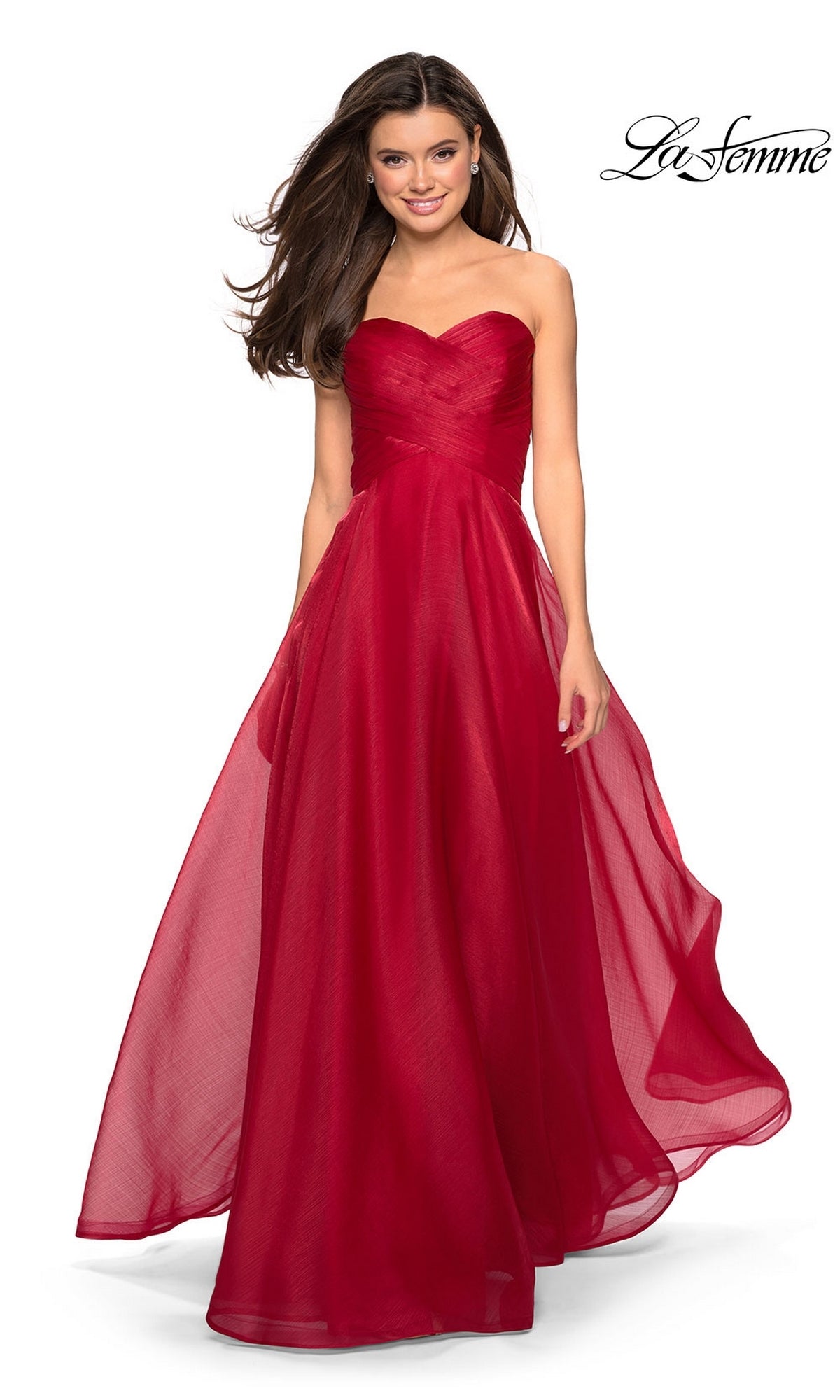 A woman wearing the La Femme Strapless Long Prom Ball Gown 27515 with a sweetheart bodice stands smiling against a white background. The La Femme logo appears in the top right corner.